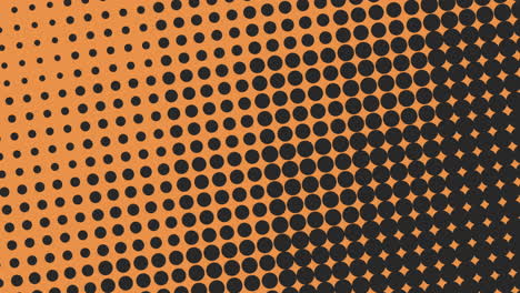 Vibrant-orange-and-black-dotted-pattern-on-background