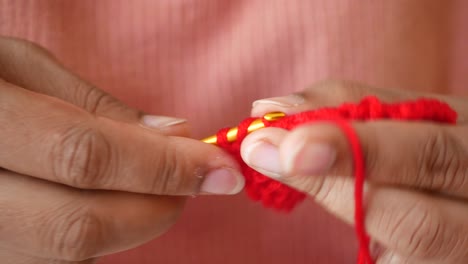 crocheting with red yarn