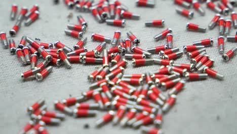 slow-motion close-up view of miniature screws in a spectacle factory. danyang, jiangsu province, china.