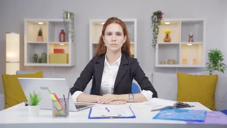 Home-office-worker-woman-says-stop-to-camera,-warns.