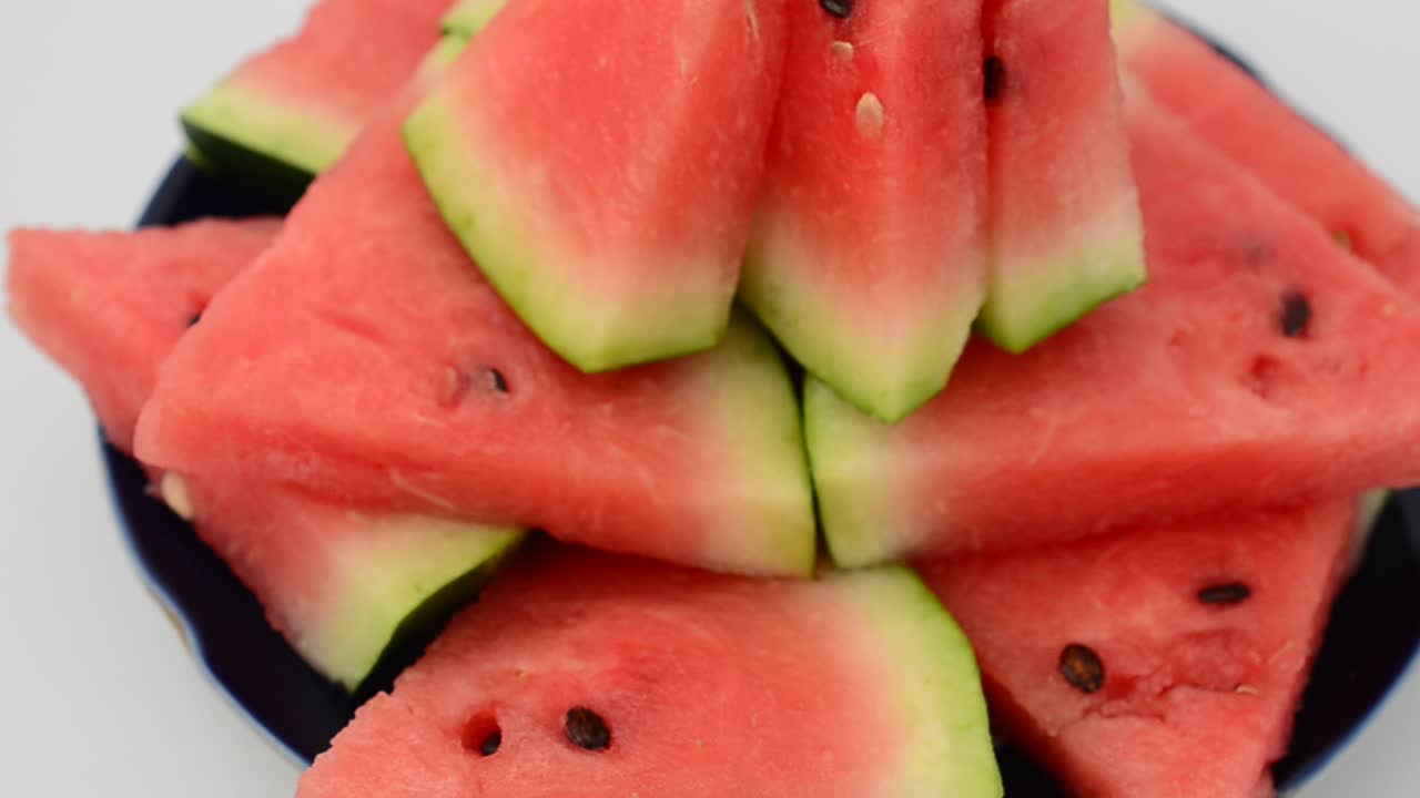 Shooting of pieces of a watermelon. Shooting in the movement