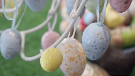 colorful easter eggs hanging on a tree