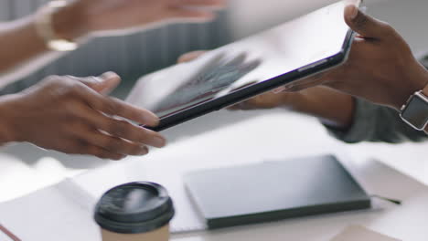 close up african american engineers developing engine turbine prototype using digital tablet computer sharing 3d design ideas on screen brainstorming mechanical project in office presentation meeting