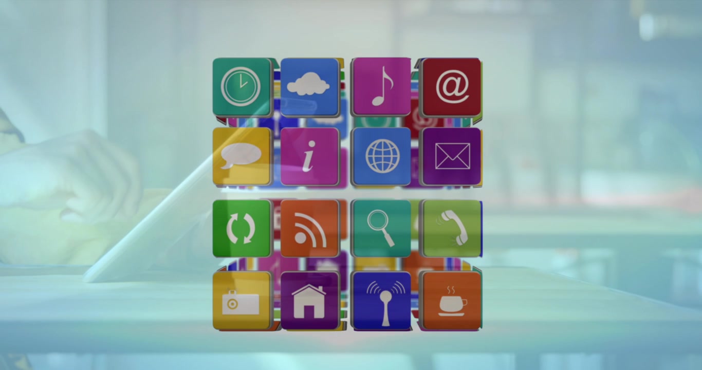 Animation of cube with icons over person using tablet