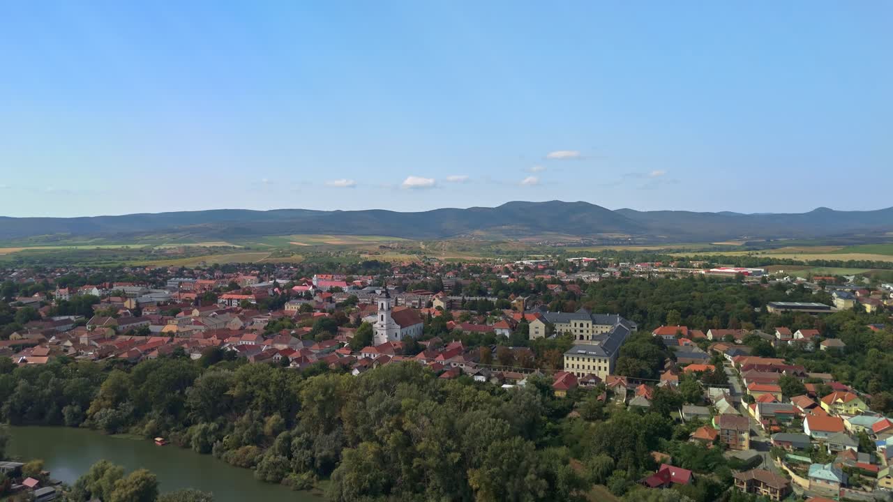 Ascending reveal drone view of the spectacular downtown of Sárospatak and Zemplén Mountains in Hungary
