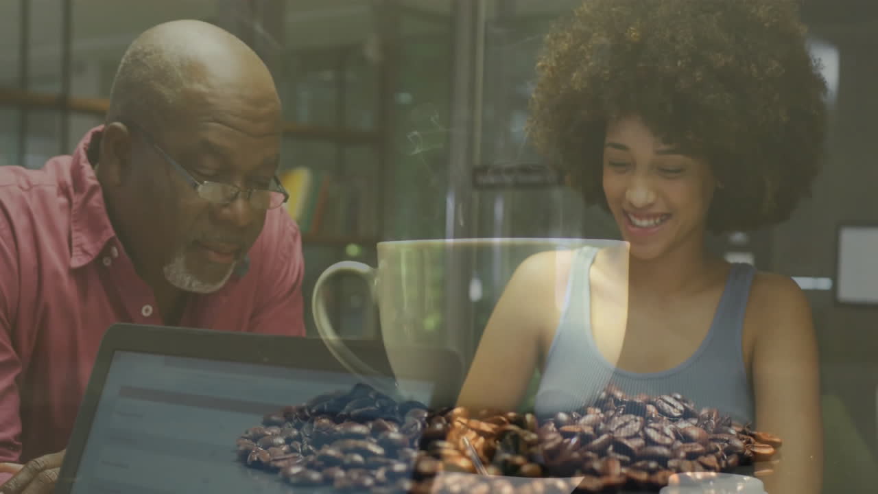 Senior male tutor guiding female student in tutoring workspace, showing animated chart and mug icon