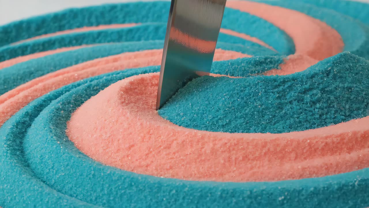 Kinetic sand spiral with knife