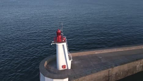 Saint-Malo-lighthouse-and-pier-at-sunset,-Brittany-in-France