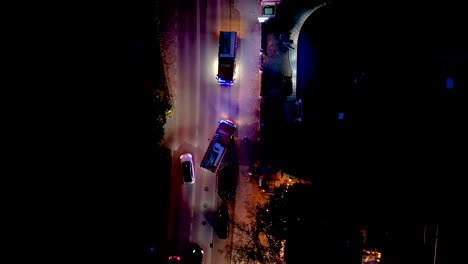 Aerial-shot-of-a-firebrigade-blaring-horn-and-rushing-through-traffic