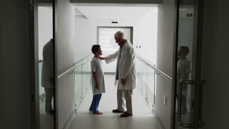 doctor interacting with patient in corridor