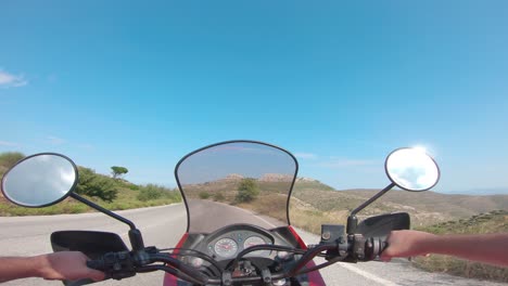 riding a motorcycle on penteli mountain in greece