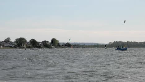 A-KIteboarder-Doing-Tricks-On-The-Wavy-Sea-On-A-Summer-Day---wide-slowmo-shot