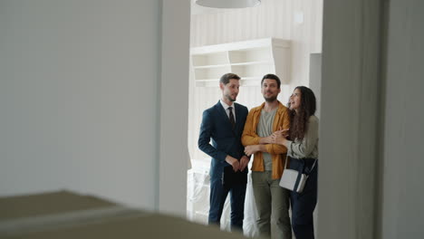 real estate agent showing property to clients