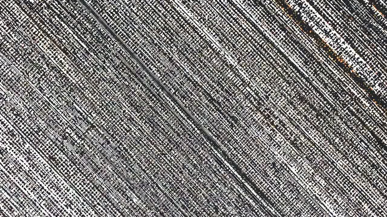 Shifting camera revealing textured surface in macro, showing diagonal groove and rusty streaks