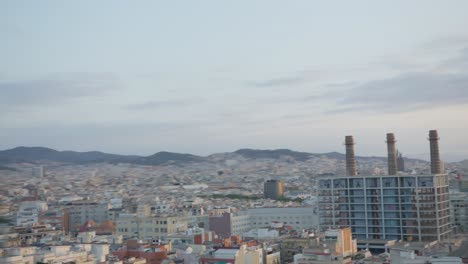 hi res view through scenic trees, from slow left to right, barcelona spain city skyline with golden sunrise in 6k as birds fly