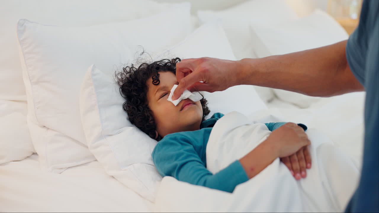 Father, hand and sick child with tissue in bed