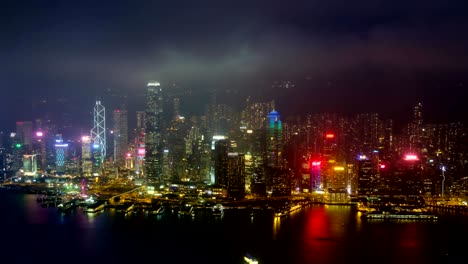 el lapso de tiempo de día a noche del horizonte iluminado de hong kong. hong kong, china