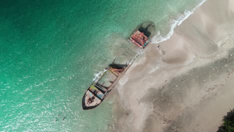 top shot ship aground on the coast of manzanillo, costa rica