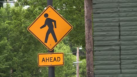 Pedestrian-crossing-ahead-sign-for-crosswalk