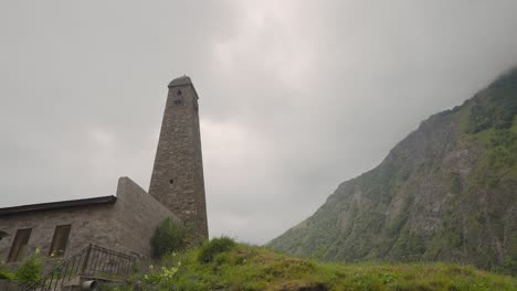 ancient tower in mountainous landscape