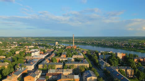 City-of-Daugavpils-on-the-banks-of-Daugava-river-at-sunset,-Aerial-View
