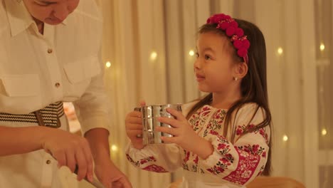 mother and daughter preparing for christmas celebration