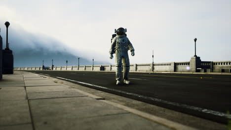 astronaut in space suit on the road bridge