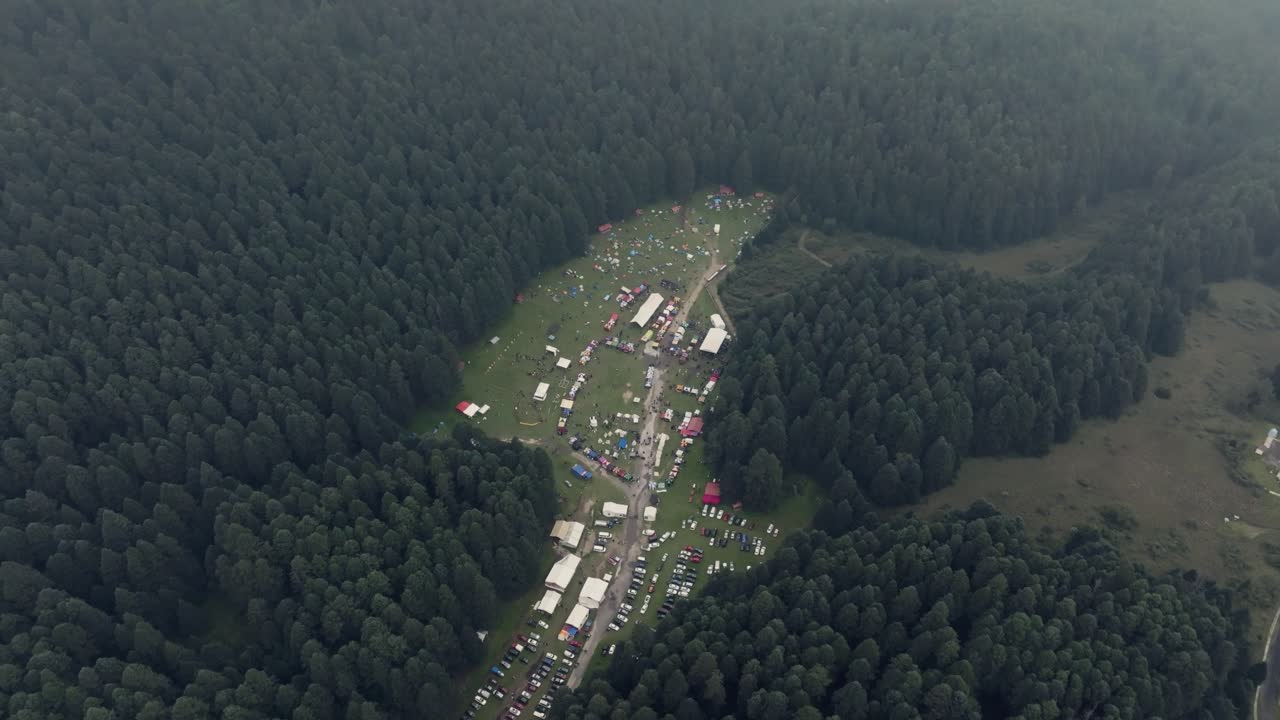 Aerial View of a Music Festival in a Forest