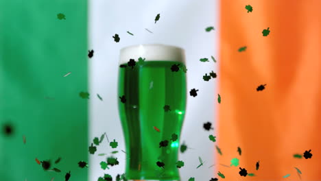 Shamrock-confetti-falling-in-front-of-green-pint