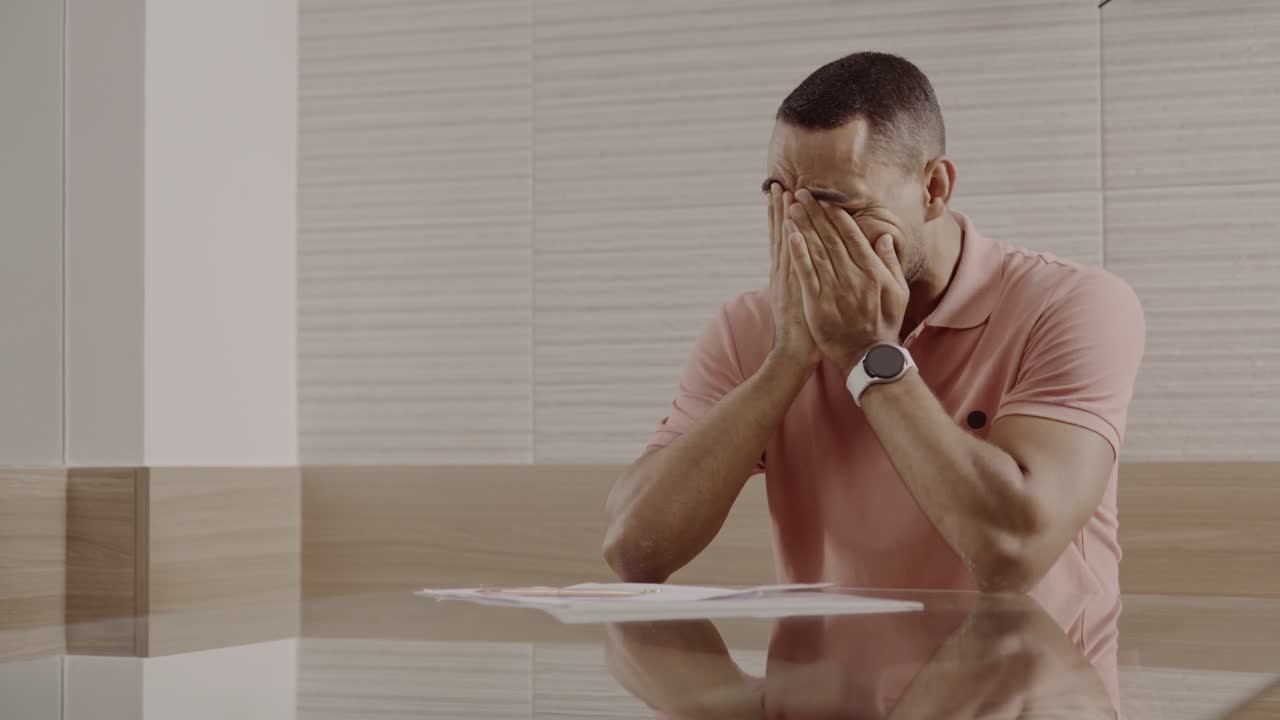 Man overwhelmed with stress and bad news