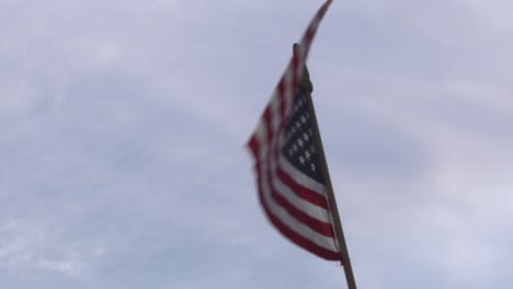 usa stars and stripes flag flying in the wind in slo mo