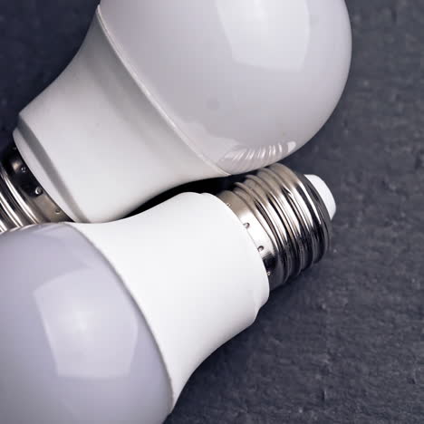 led light bulbs on table with dark background