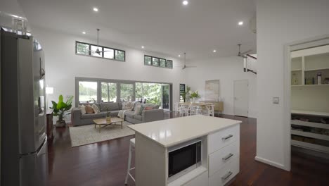 Open-plan-living-area-and-kitchen-with-wooden-floorboards