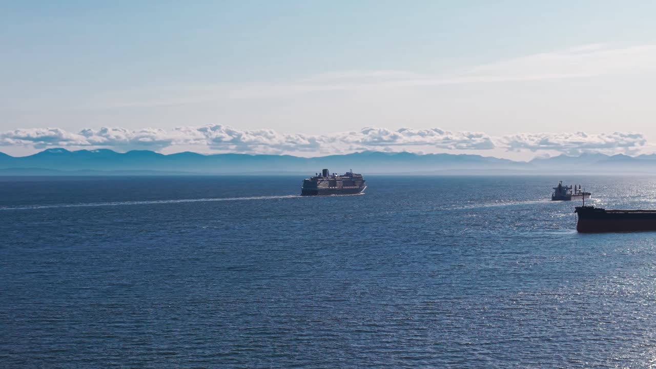 A scenic shot of a cruise ship sailing on the beautiful seas of west vancouver under a clear blue summer sky