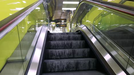 ascending escalator in vibrant naples train station