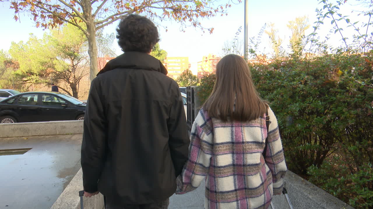 Couple Walking with Luggage