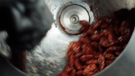 chocolate coated nuts in a mixer