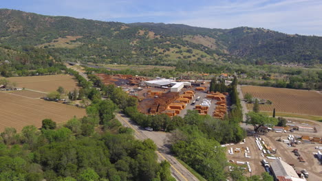 aerial view across mendocino highway timber yard in lush california mountains