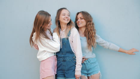 three happy young women having fun outdoors