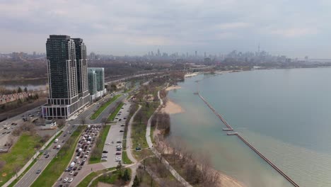 Drone of Park Lawn neighborhood and waterfront skyline in Toronto, summer