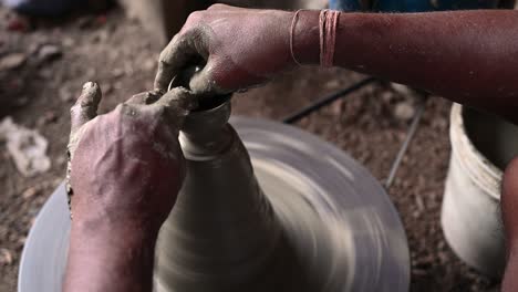 traditional diya made of clay and mud placed in sunlight at diya factory in rural india.