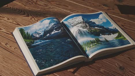 open book featuring mountain scenery