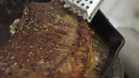 frying meat steak inside frying pan