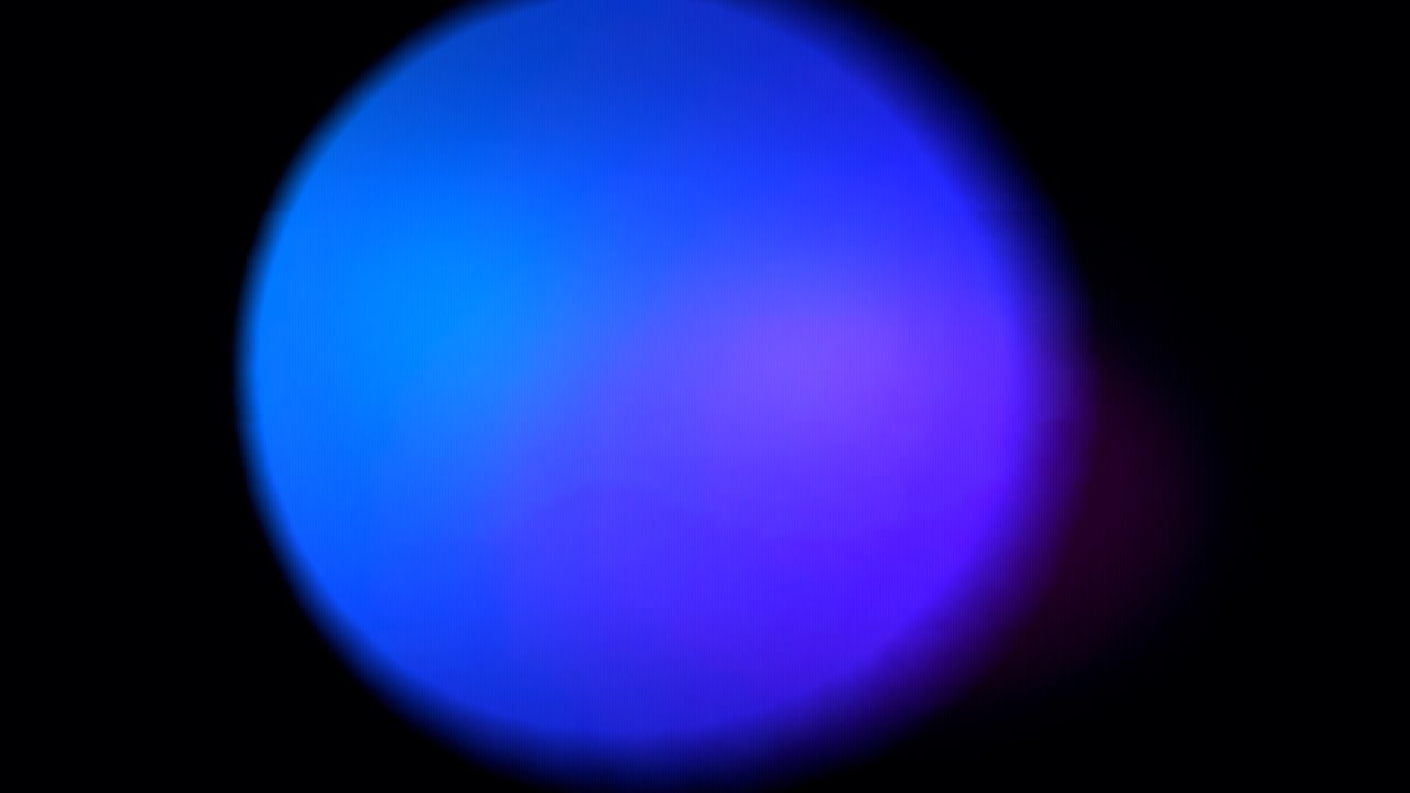 Abstract Blue Light Bokeh Effect on Black Background