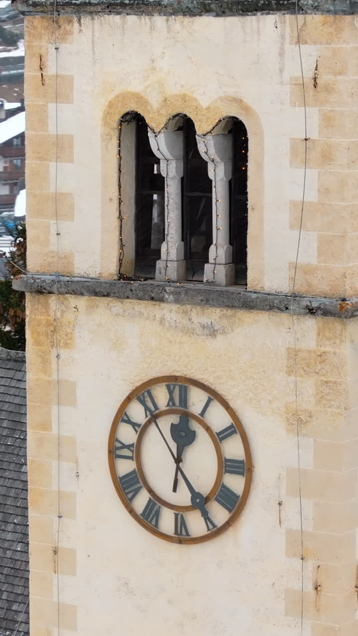 Aerial drone view of the Chiesa di Arabba in the Arabba village, in the Dolomites, Italy. Vertical