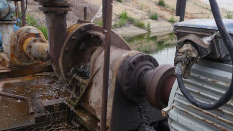 old rusty water pump with leak