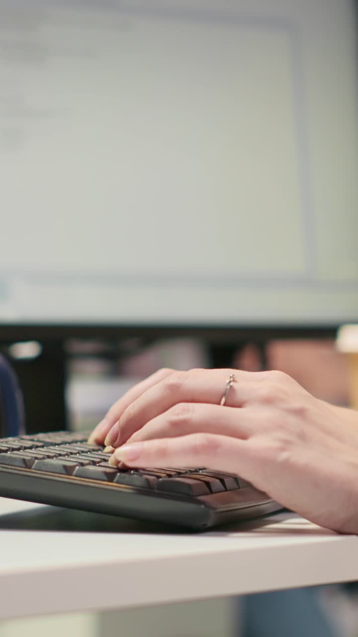 Vertical video Startup office IT professional using AI LLM chatbot, optimizing systems