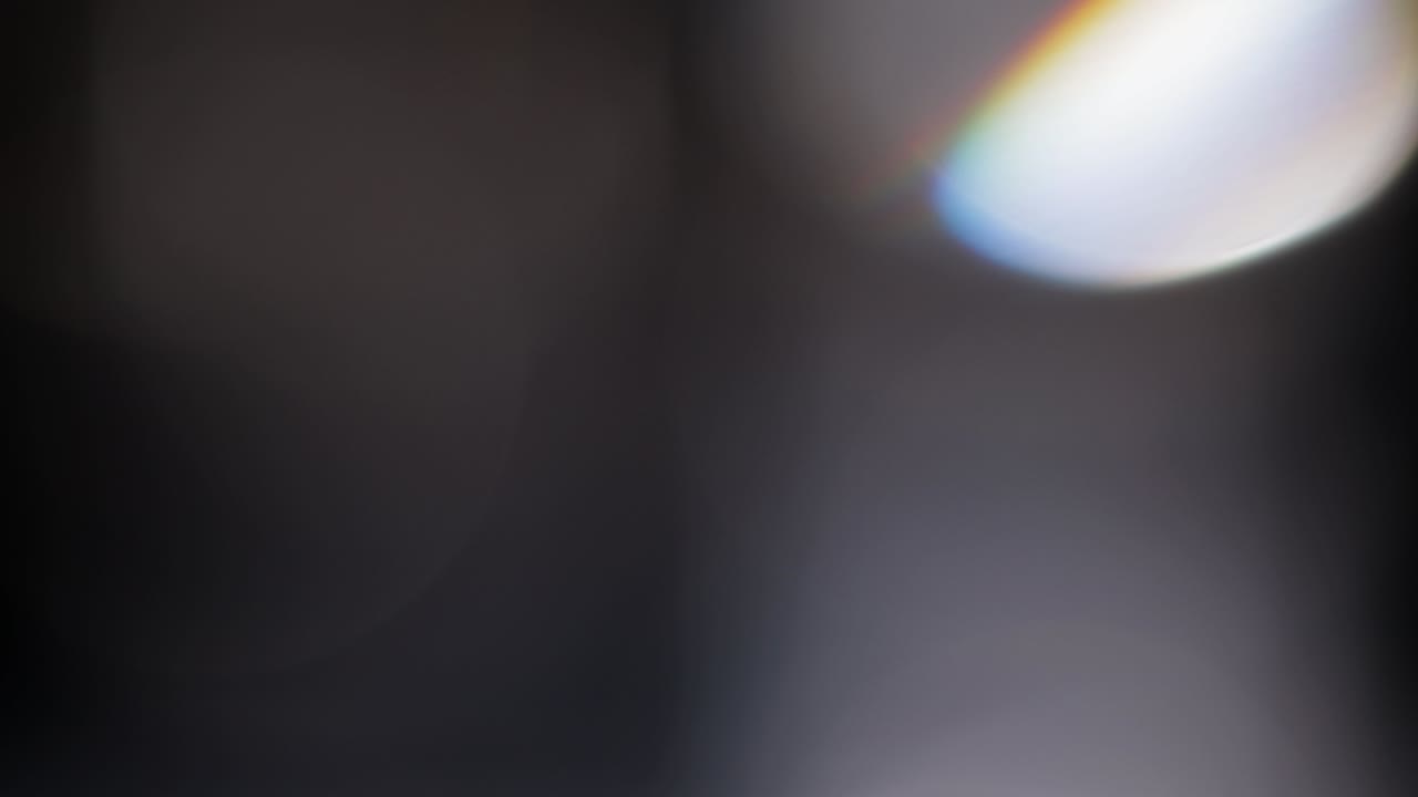 Multicolored light leaks footage on black background, lens flare leak burst overlays transitions