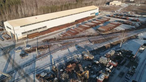 aerial view of round metal pipes in warehouse. outdoors storage site.