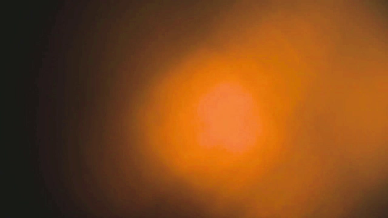 Abstraktes warmes oranges Lichtlecks und Lens Flare
